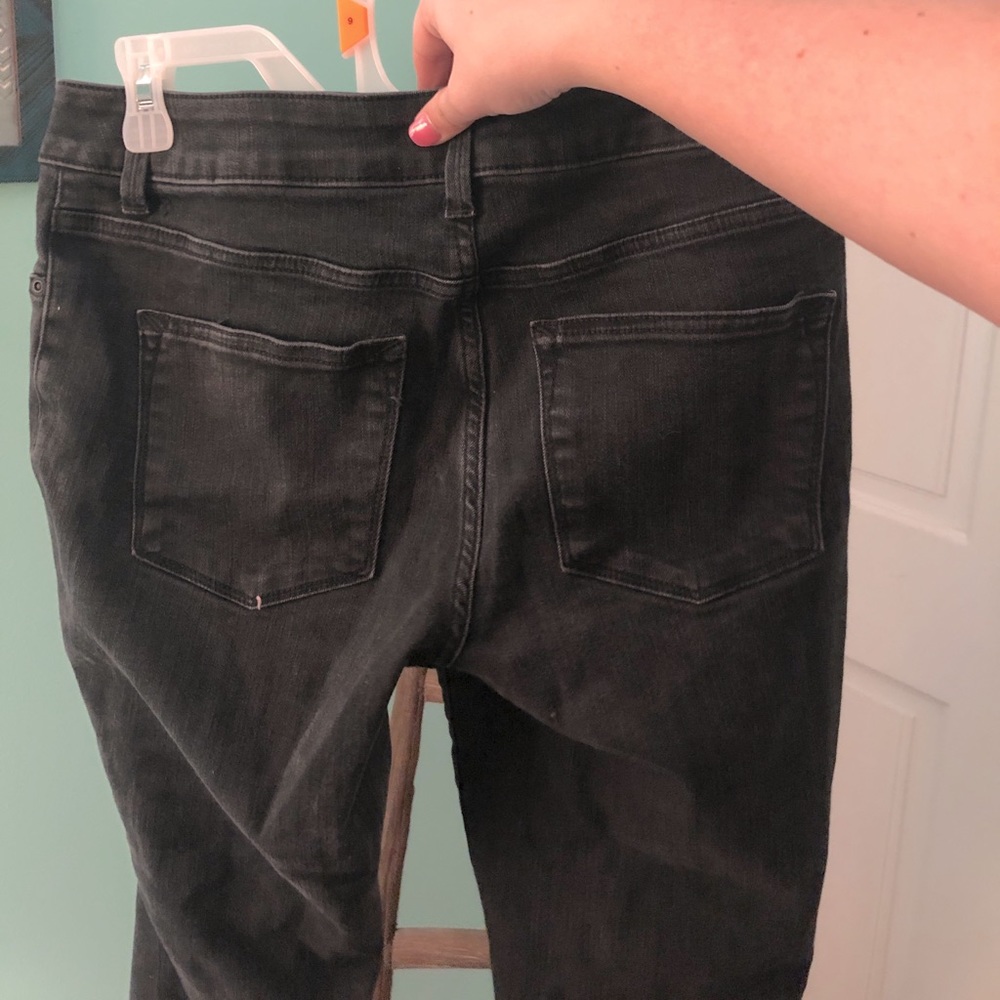 Distressed black skinny jeans